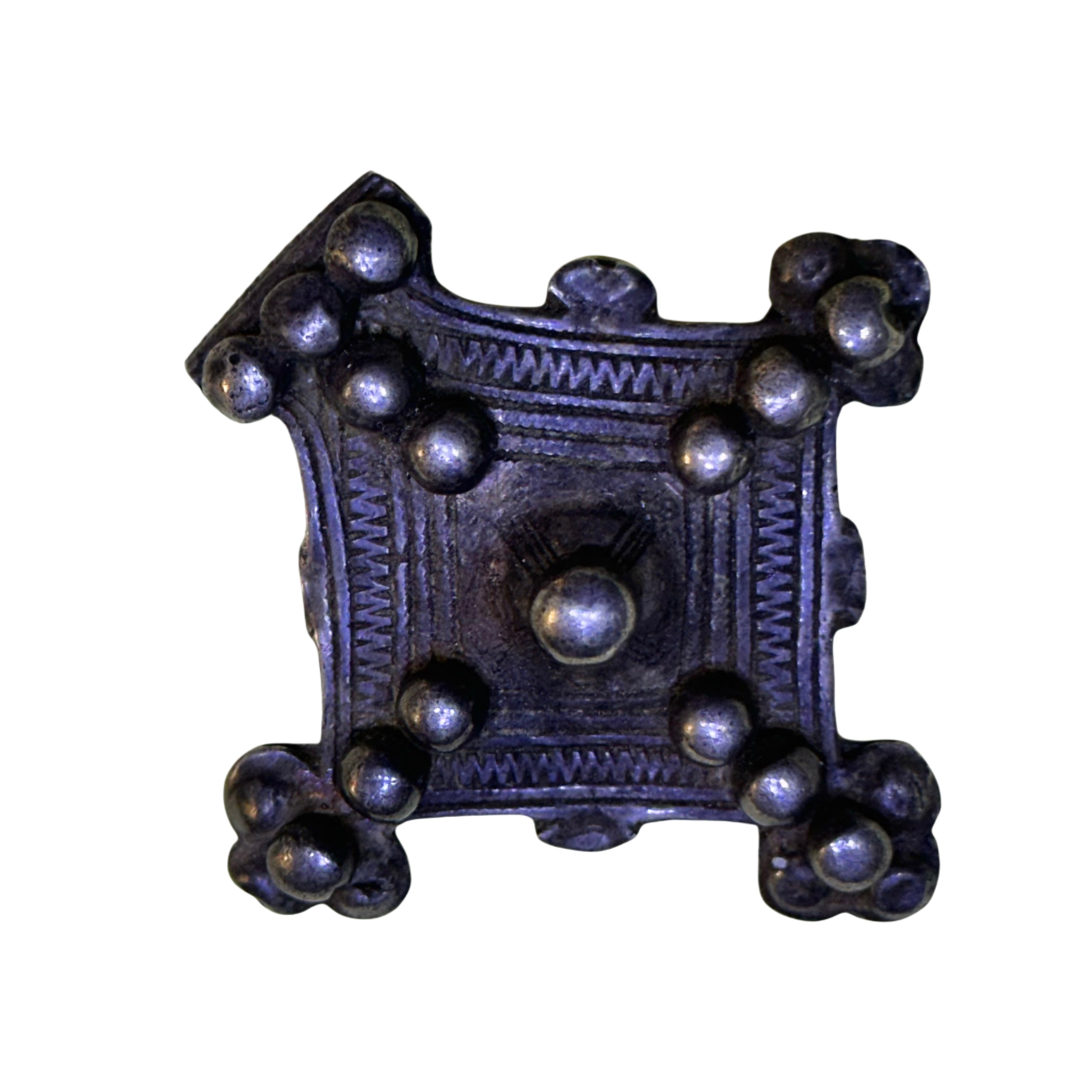 A traditional Moroccan Amazigh necklace, called "Baghdad" or "Southern Cross", is part of the traditional adornment in the Atlas and Sahara regions, especially among the Amazigh of southern Morocco, specifically the Tata and Oued Noun regions.