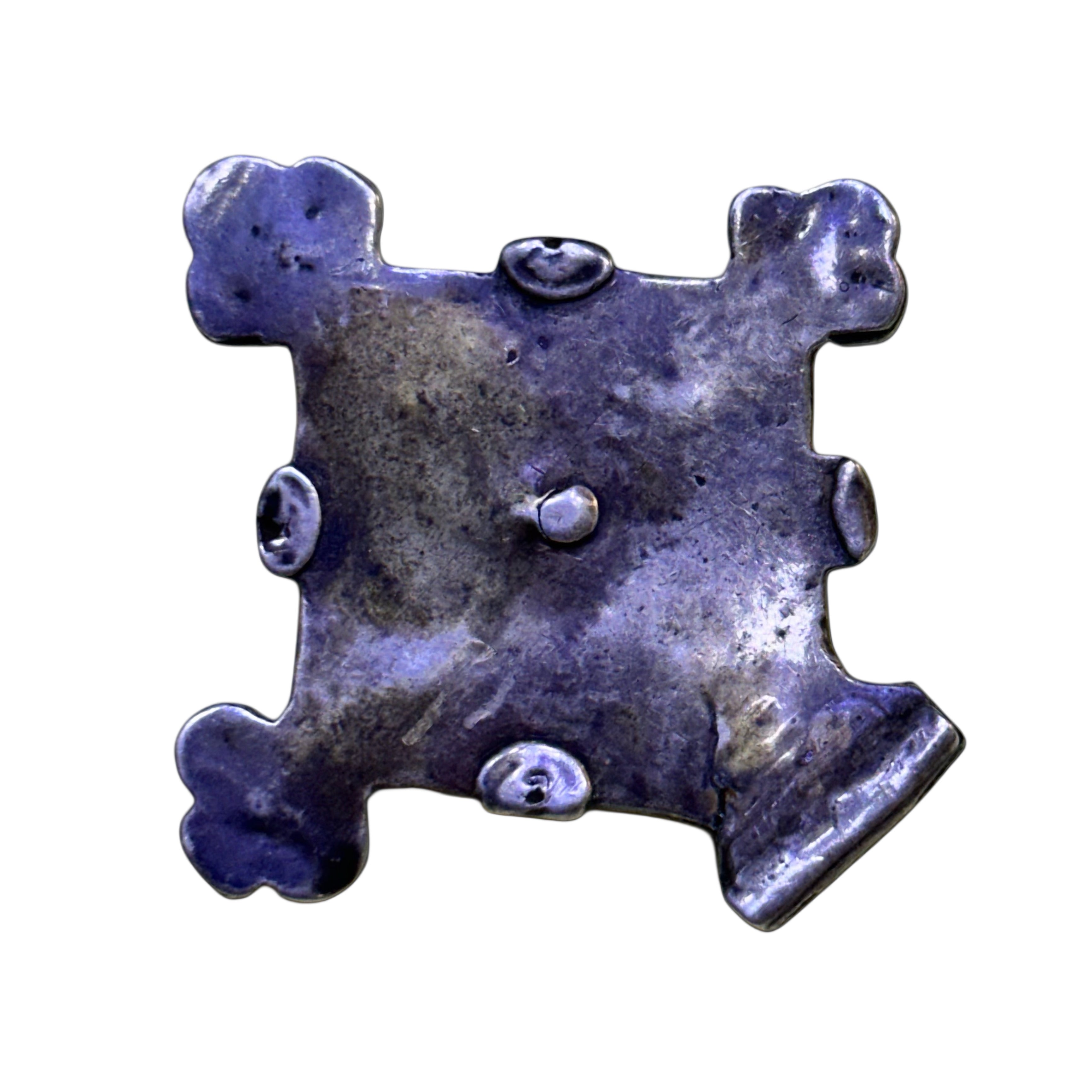 A traditional Moroccan Amazigh necklace, called "Baghdad" or "Southern Cross", is part of the traditional adornment in the Atlas and Sahara regions, especially among the Amazigh of southern Morocco, specifically the Tata and Oued Noun regions.